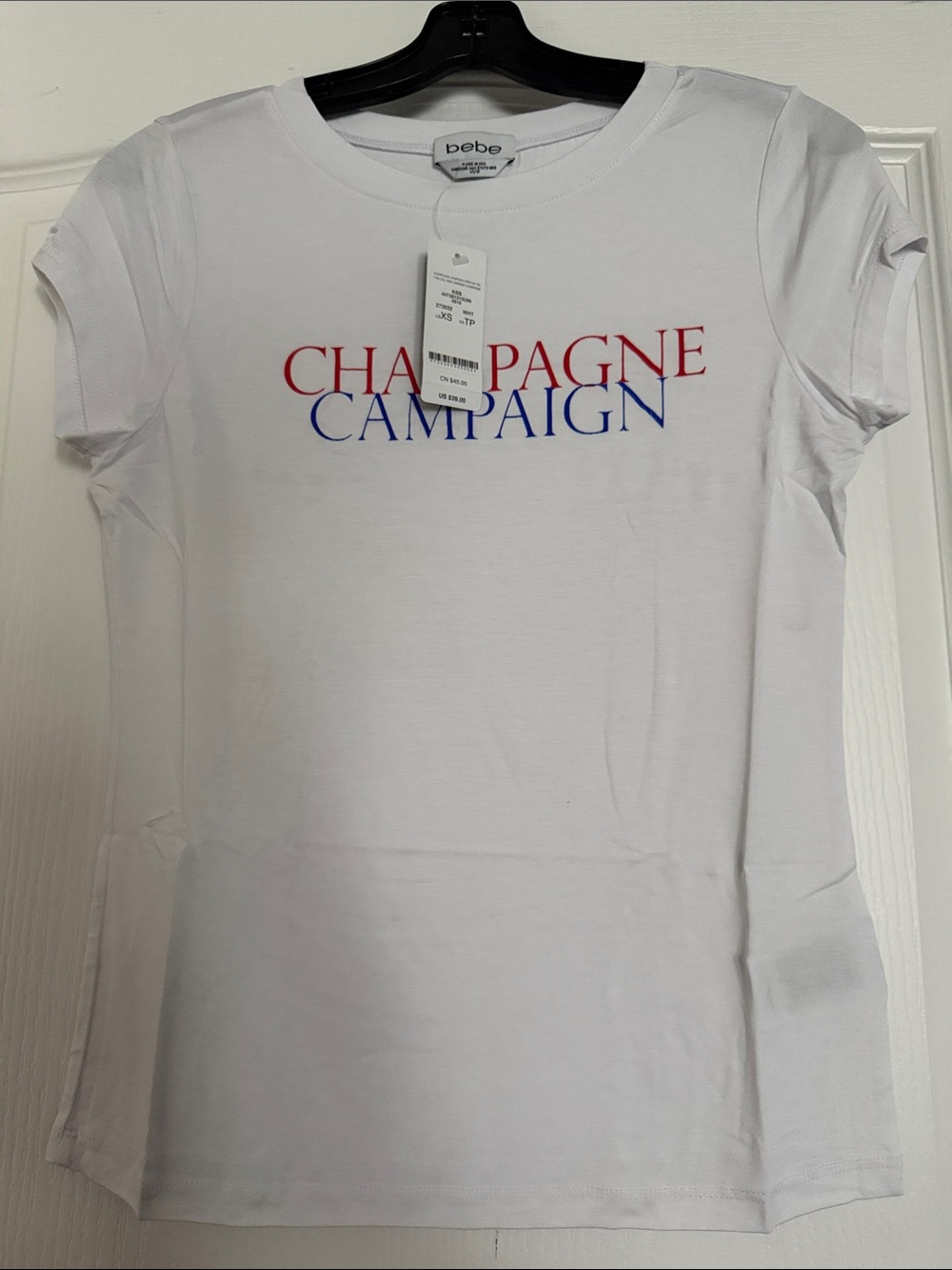 New Bebe White Tee with Red and Blue 'Champagne Campaign' Text Sz Xs.